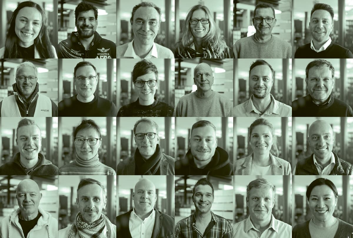 A grid of 20 individual portrait photos arranged in four rows, each showing a person smiling or looking at the camera. The image has a greenish tint.