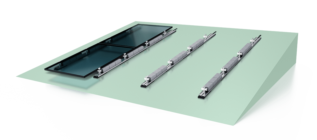A solar panel with two rows of mounting hardware and connectors displayed on a green surface.