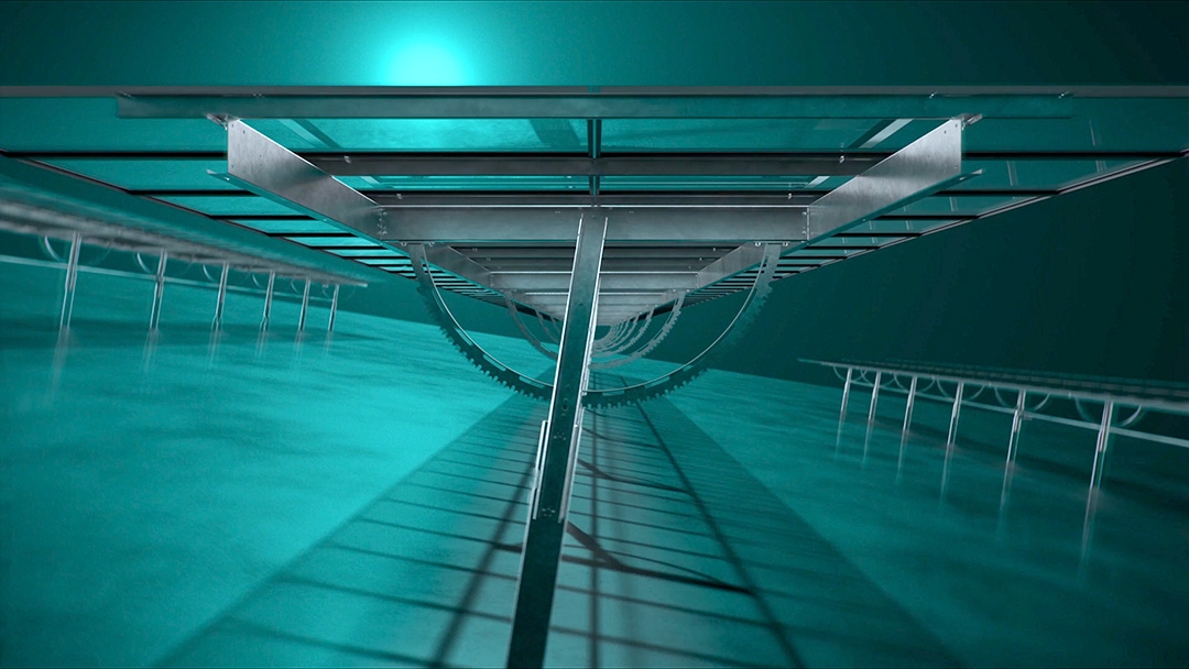 Underwater view of a submerged structure with metal beams and railings, illuminated by teal light, suggesting industrial or research applications.