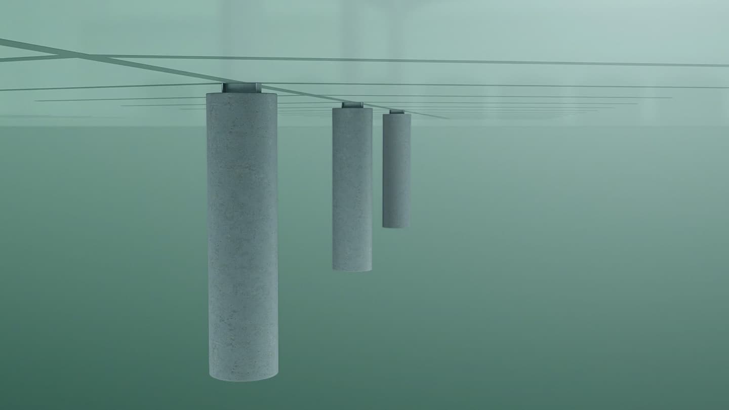 Four cylindrical concrete pylons submerged in clear, green-tinted water supporting an overhead structure.